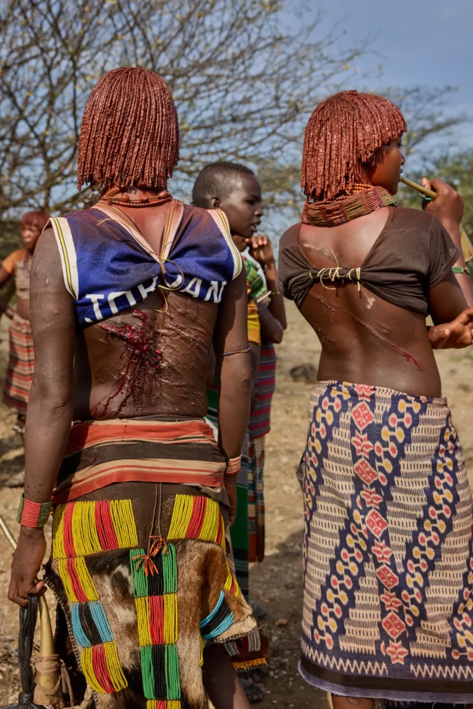 Hamar women with ceremonial whipping scars during bull jumping ritual in Ethiopia | Michaela Pupíková Photography