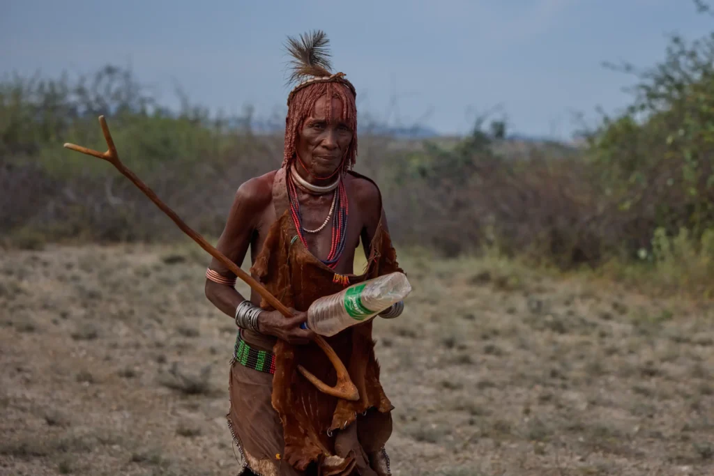 Young Hamar man with body paint and ritual stick after initiation in Ethiopia | Michaela Pupíková Photography