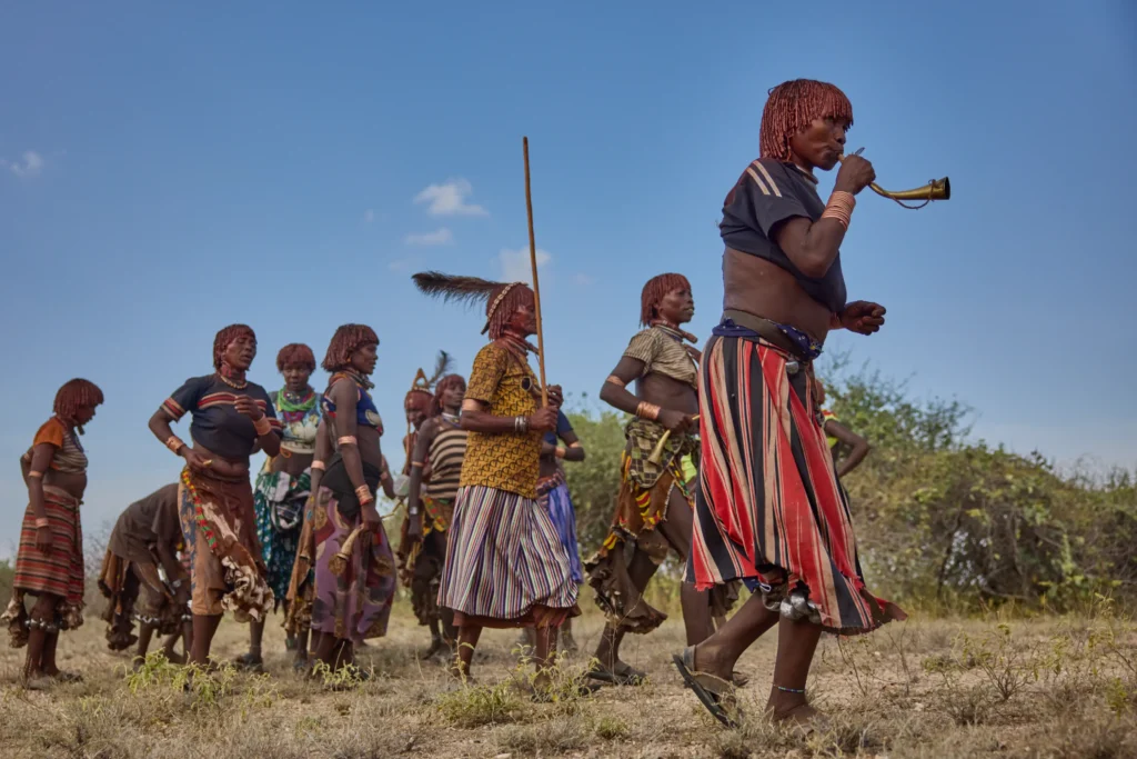 Hamar women marching and dancing during bull jumping ceremony in Ethiopia | Michaela Pupíková Photography