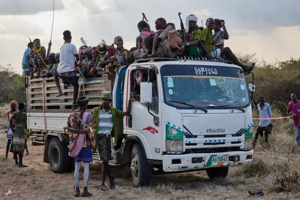 Hamar tribe arriving on truck for bull jumping and whipping ceremony in Ethiopia | Michaela Pupíková Photography